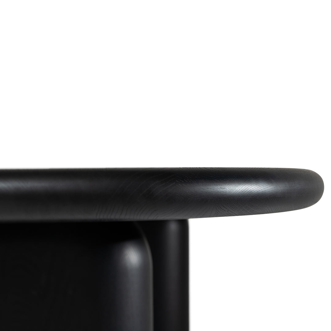 Sleek black surface with smooth rounded edges and a minimalist design, perfect for modern decor.