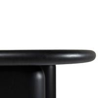 Sleek black surface with smooth rounded edges and a minimalist design, perfect for modern decor.