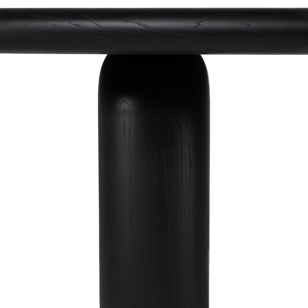 Black cylindrical table base with a smooth matte finish, featuring simple, modern lines and no visible patterns.