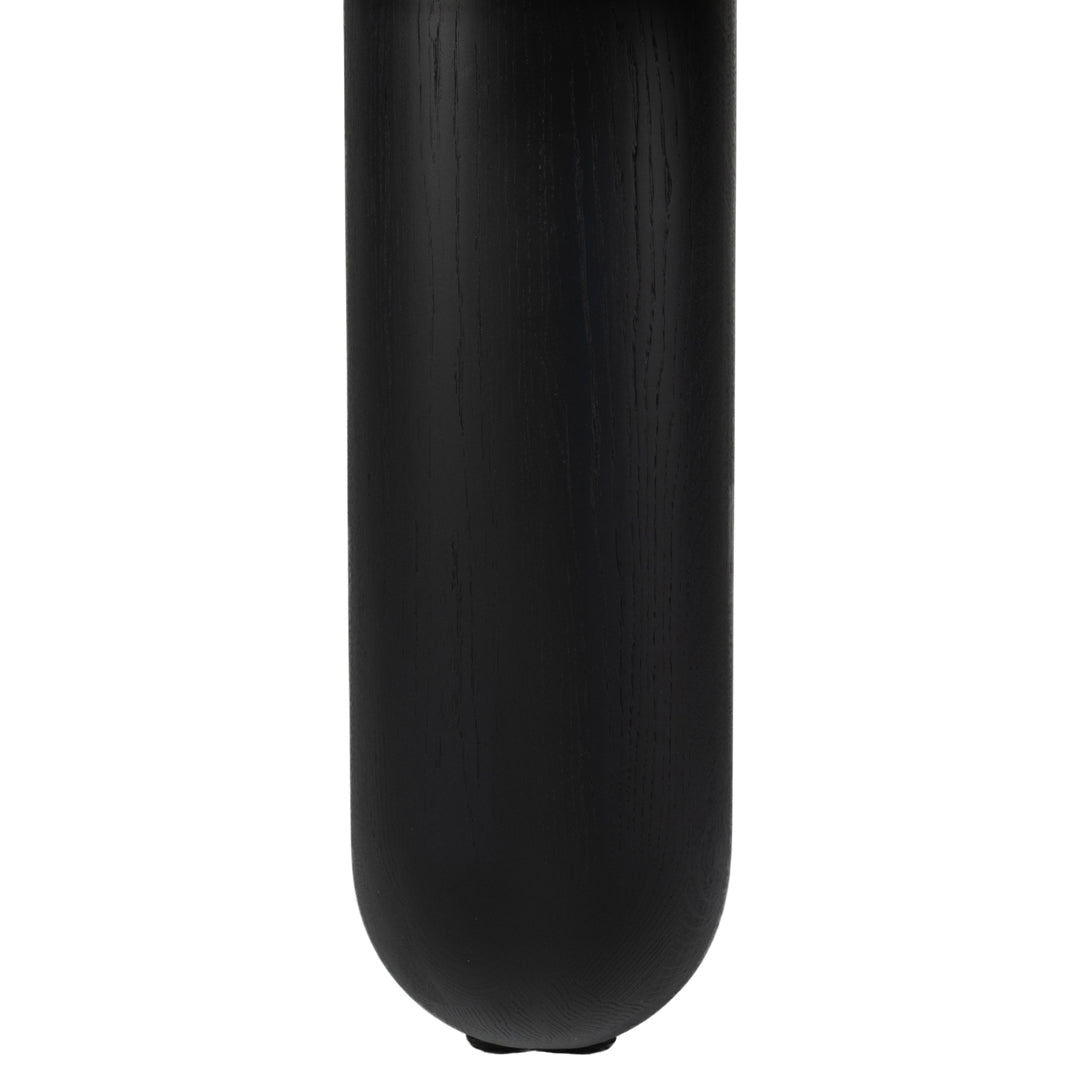 Sleek black ceramic vase with a smooth, matte finish and subtle vertical lines. Perfect for modern decor.