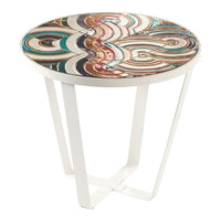 Colorful round side table with swirling patterns in teal, brown, and cream on a white metal base.
