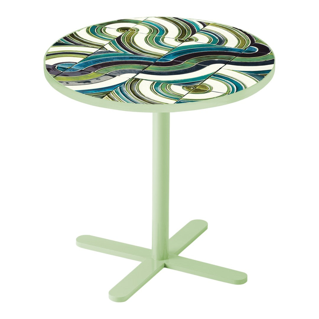 Round table with a colorful swirling pattern in teal, green, and purple, set on a light green base. Perfect for decor.