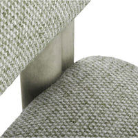 Textured green fabric with a subtle pattern, paired with a sleek metal frame. Ideal for modern decor.