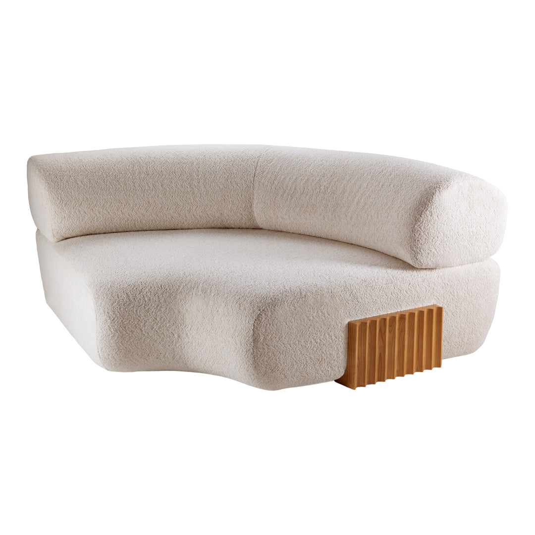Creamy beige sofa with textured fabric and wooden accent, showcasing a modern, minimalist design.