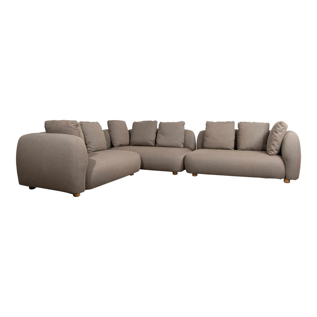 Taupe sectional sofa with smooth fabric, oversized cushions, and rounded arms, perfect for cozy living spaces.