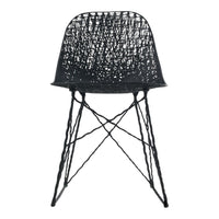 Black woven chair with a textured pattern and slender cross-legged base. Ideal for modern decor.