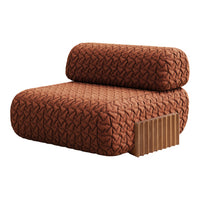 Rust-colored plush chair with tufted pattern and wooden accent, offering a modern, textured look.
