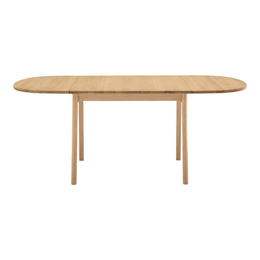 Light wood dining table with a smooth, natural grain finish and modern oval shape, featuring simple wooden legs.