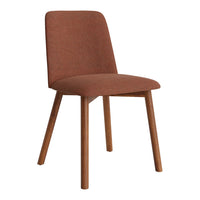 Rust-colored upholstered chair with simple lines and wooden legs, perfect for modern and minimalist interiors.