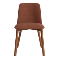 Textured rust-colored chair with wooden legs, featuring a minimalist design and modern aesthetic.