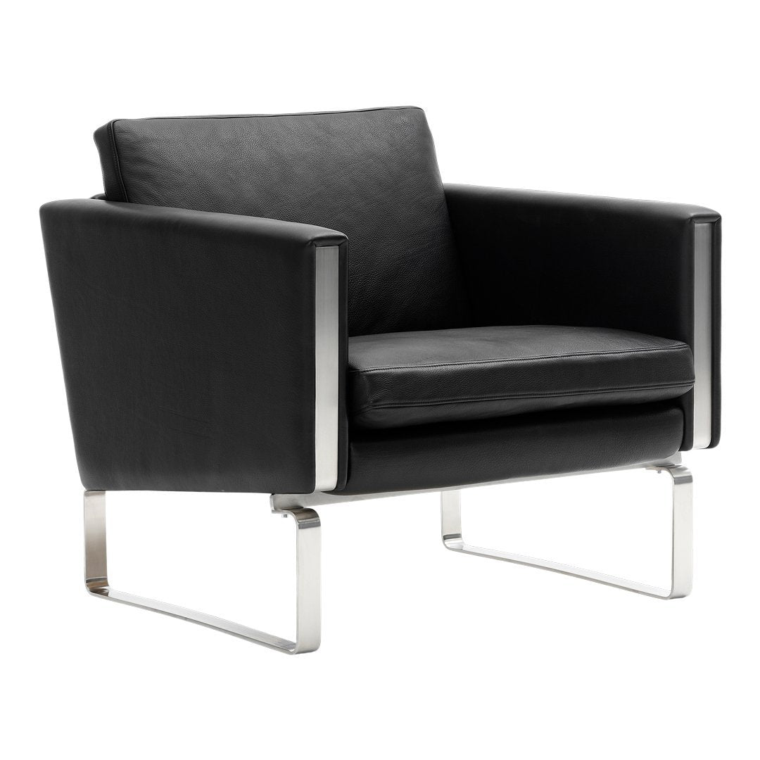 Black leather armchair with sleek chrome accents and minimalistic design. Perfect for modern interiors.