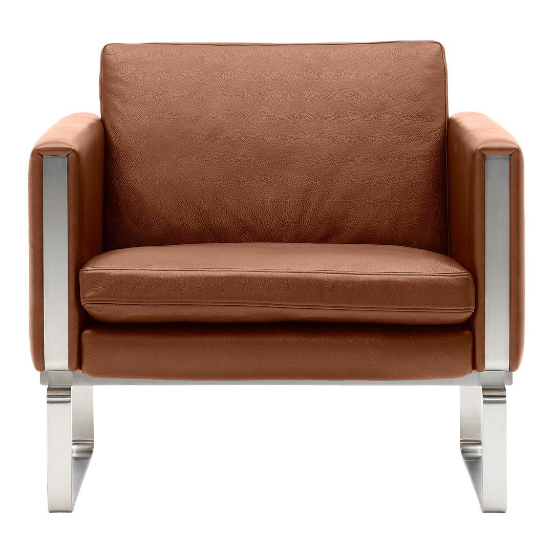 Brown leather armchair with sleek silver metal accents and minimalist design, ideal for modern interiors.