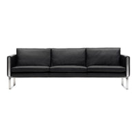 Black leather sofa with sleek chrome legs and clean, modern lines. Perfect for a contemporary living space.
