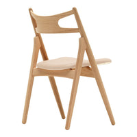 Natural wood chair with a light beige seat, featuring a smooth, minimalist design and elegant curved backrest.