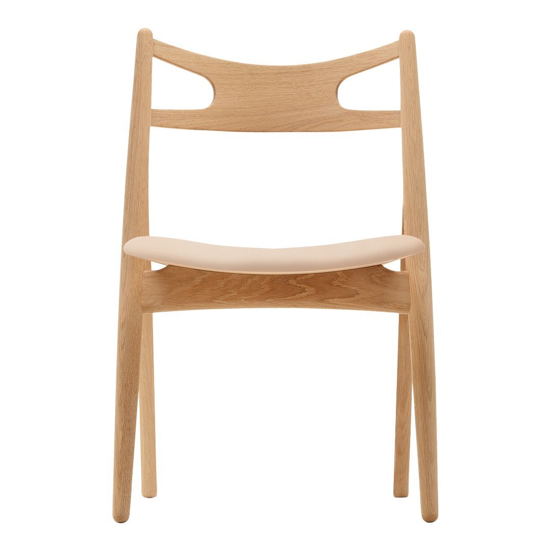 Light natural wood chair with a smooth, minimalistic design and subtle curved cutouts on the backrest.