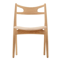 Light natural wood chair with a smooth, minimalistic design and subtle curved cutouts on the backrest.