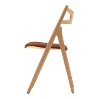 Wooden chair with a light oak frame and a rich brown leather seat, featuring a sleek, minimalist design.