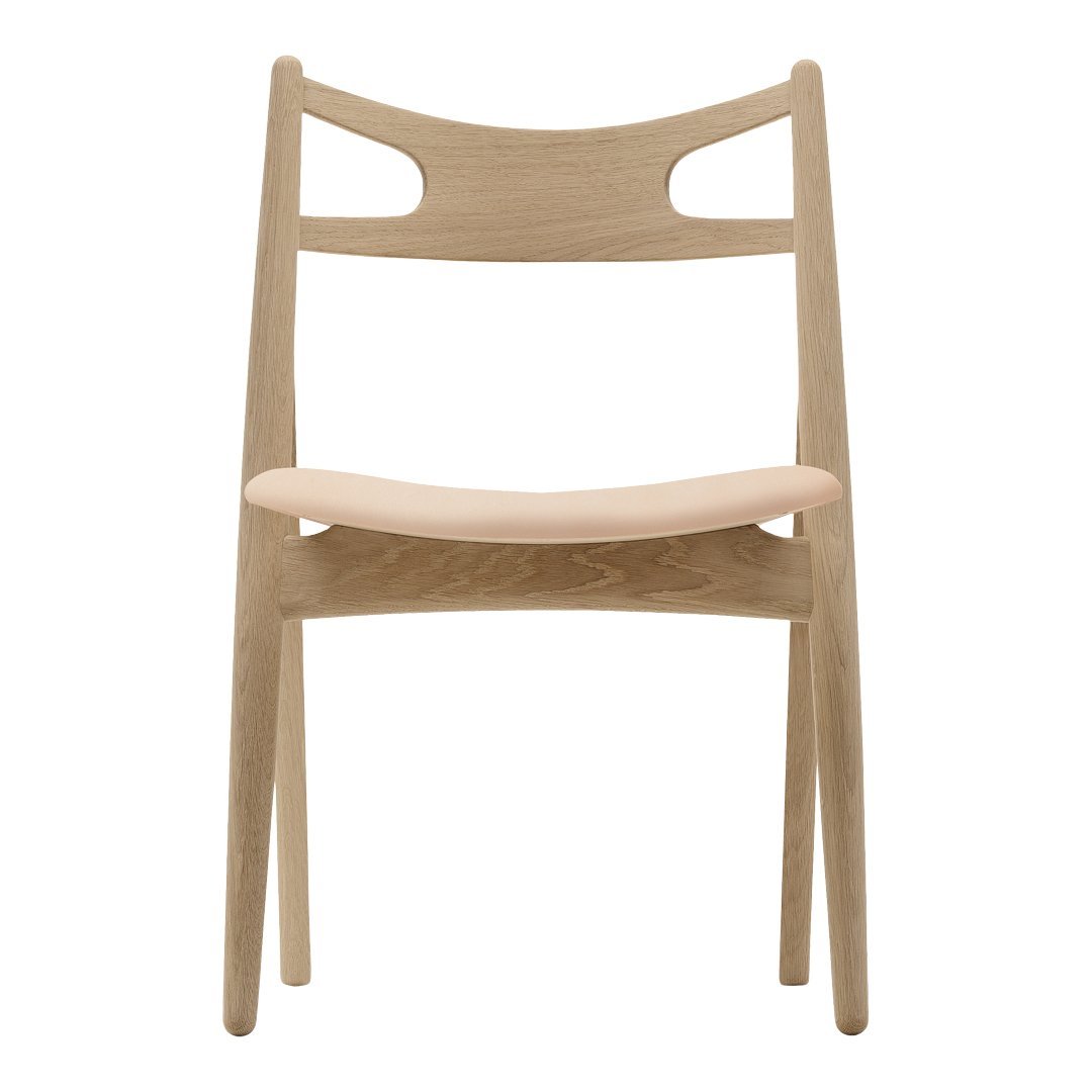 Light wood chair with a natural finish and minimalist design, featuring smooth lines and subtle curves.