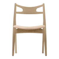 Light wood chair with a natural finish and minimalist design, featuring smooth lines and subtle curves.