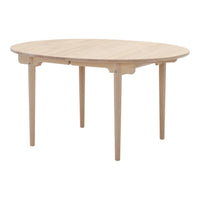 Light oak round table with a minimalistic design and natural wood grain pattern. Ideal for modern interior spaces.