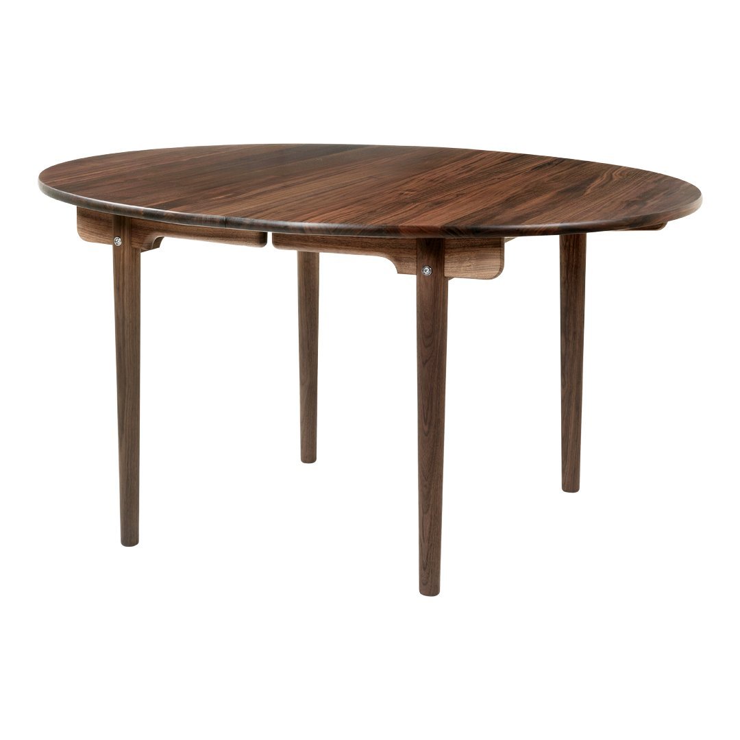 Round wooden table with a rich walnut finish and smooth surface, featuring minimalist design and tapered legs.