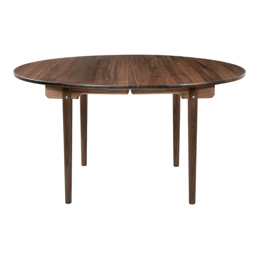Round wooden dining table with a rich walnut finish and a smooth, modern design. Perfect for any dining space.