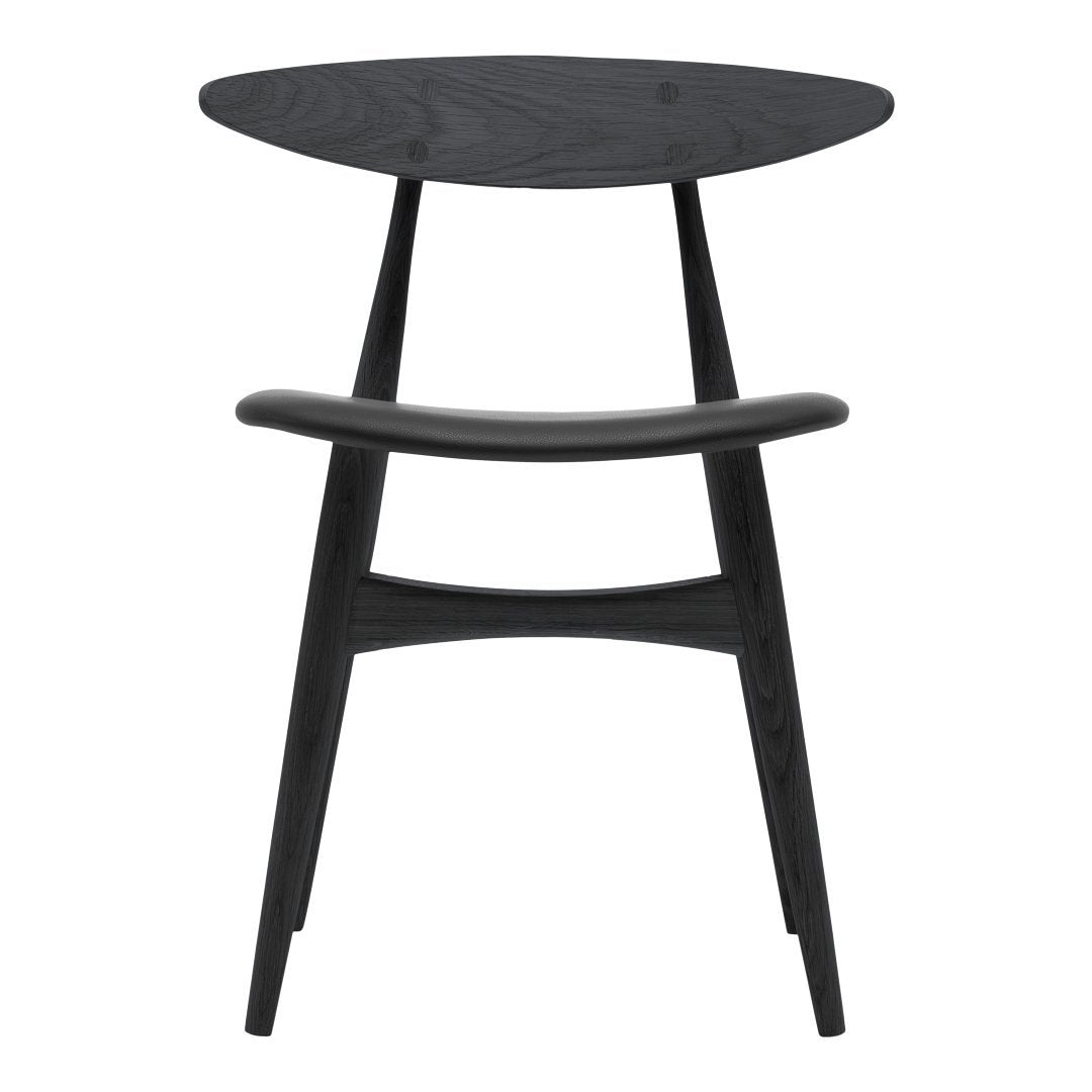 Black wooden chair with a sleek oval top and minimalist design, featuring smooth, clean lines and a modern aesthetic.