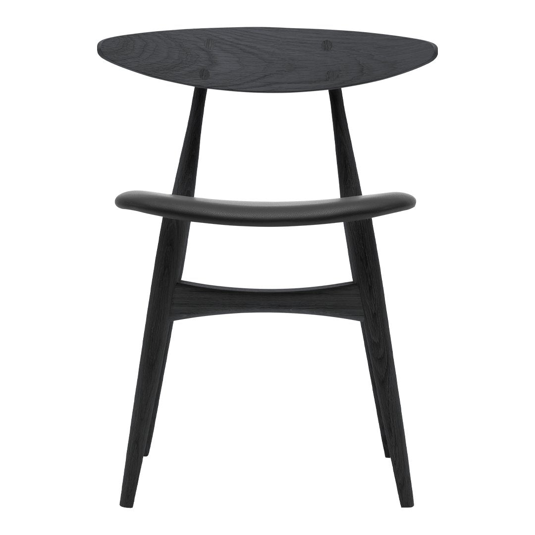 "Modern black wooden chair with smooth, sleek curves and an oval seat for a minimalist aesthetic."