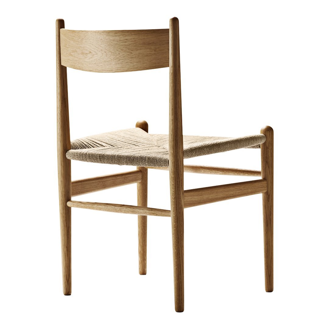 Natural wood chair with a light beige woven seat and minimalist design. Simple, elegant finish enhances any decor.