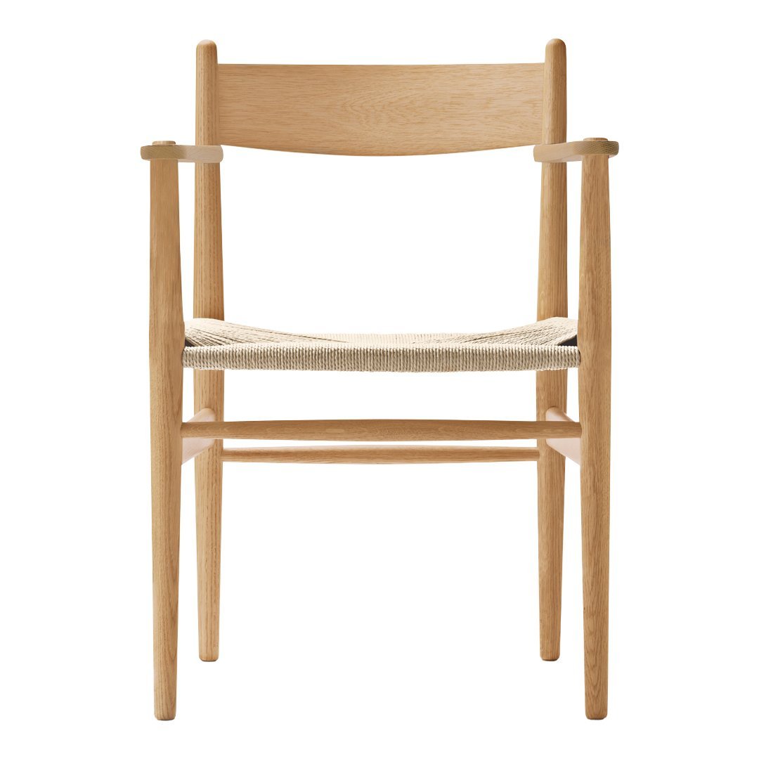 Light wood chair with a natural woven seat, featuring minimalist design and neutral tones. Perfect for modern decor.