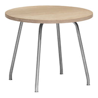 Round wooden table with a light oak surface and sleek silver legs, featuring a minimalist design.