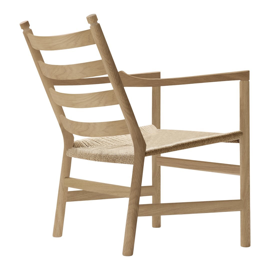 Light wood chair with a woven seat, featuring a minimalist design and natural finish, ideal for modern decor.