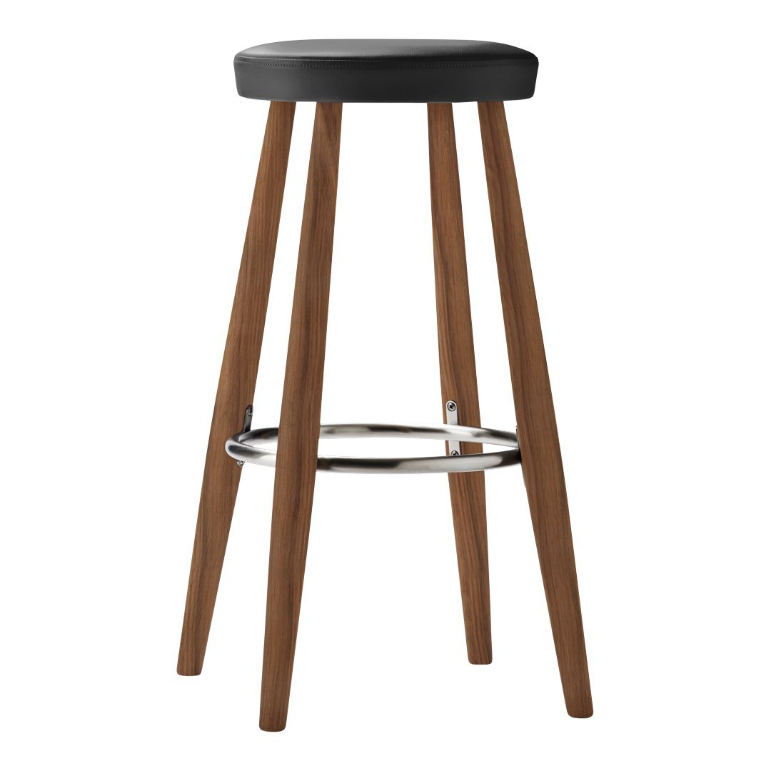 Black padded seat bar stool with natural wood legs and chrome footrest, adding a modern touch to any space.