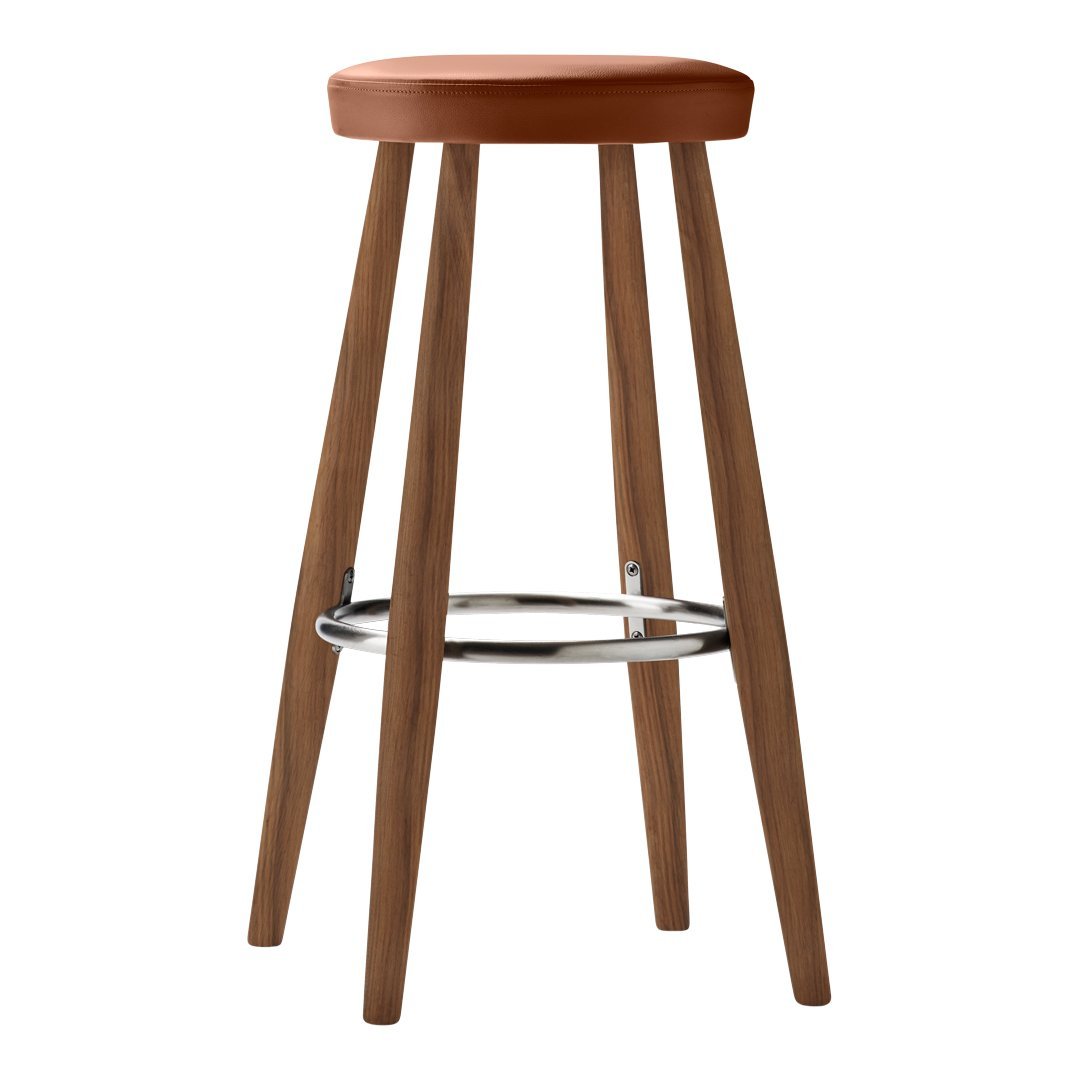 Brown wooden stool with a rust-colored padded seat and sleek chrome footrest. Simple, modern design.