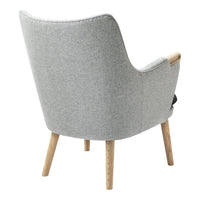Grey fabric armchair with light wood legs, featuring a smooth, modern design and gentle curves.