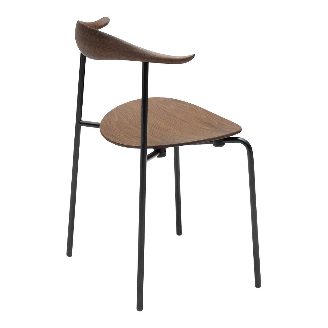 Modern chair featuring a sleek black metal frame and warm walnut wood seat with a smooth, minimalist design.