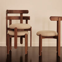 Wooden chairs with a rich brown finish and soft beige cushions, featuring a minimalist design and clean lines.