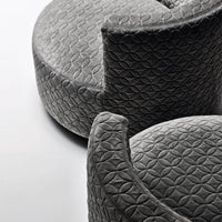 Gray upholstered accent chairs with a textured floral pattern. Soft and modern design for stylish interiors.