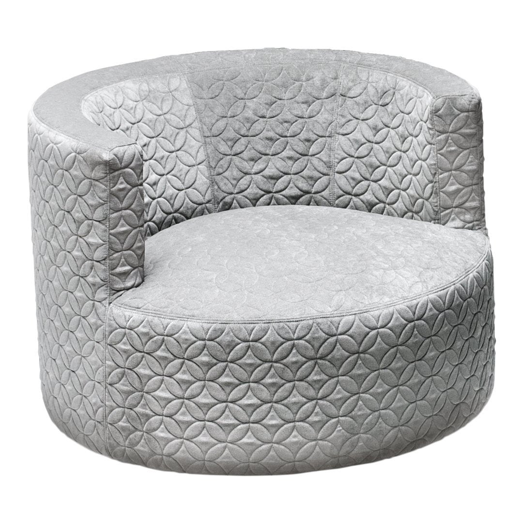 Silver circular chair with textured geometric pattern, featuring a plush upholstery for a modern look.