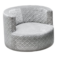 Silver circular chair with textured geometric pattern, featuring a plush upholstery for a modern look.