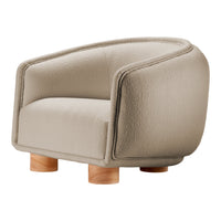 Beige textured armchair with rounded edges and natural wood legs, perfect for contemporary decor.