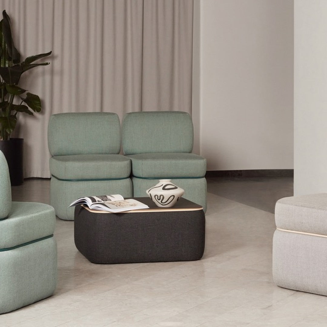 Mint green and charcoal seating with gray accents, featuring soft textures and contemporary patterns.