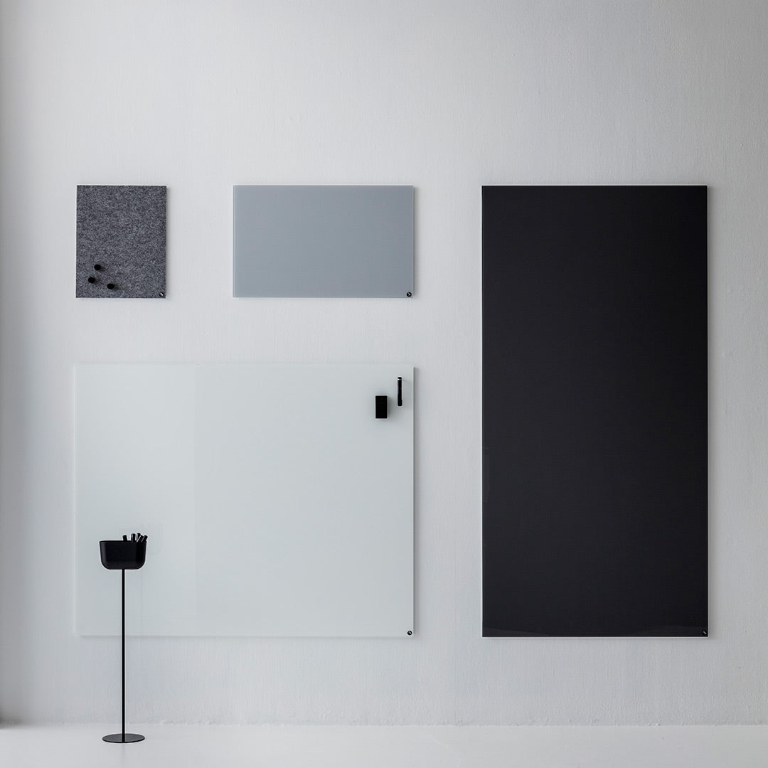 "Collection of minimalist wall panels in black, gray, and frosted glass with textured and smooth finishes."