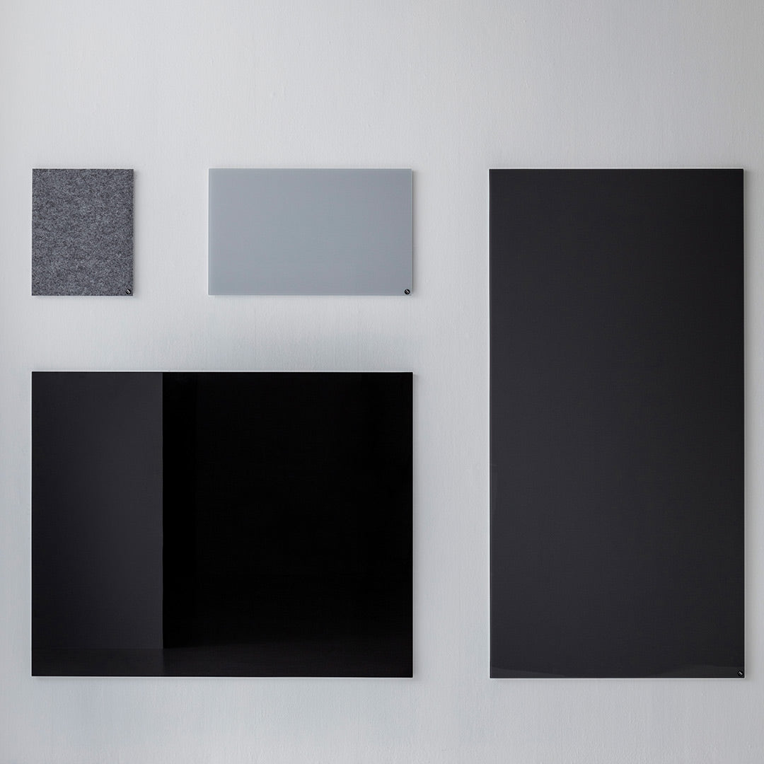 "Collection of modern panels in black, gray, and textured patterns against a neutral background."