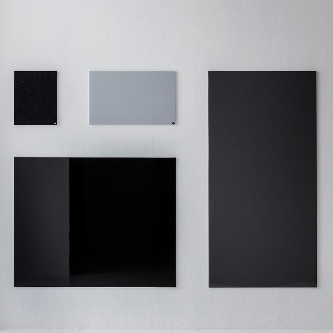 Collection of sleek black and gray wall panels featuring a minimalist design and various geometric shapes.