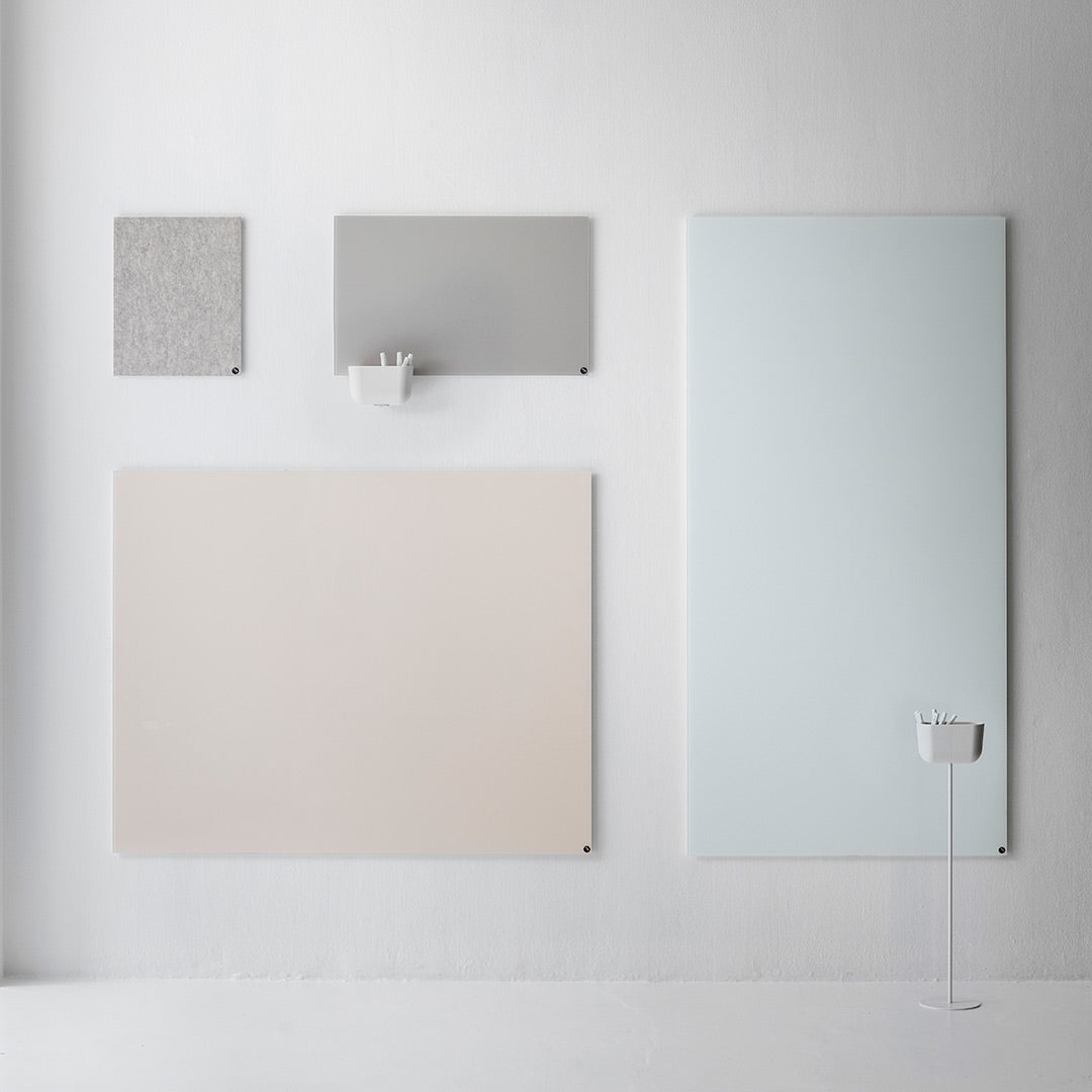 Light gray, soft beige, mint green, and textured gray wall art panels arranged on a minimalist background.