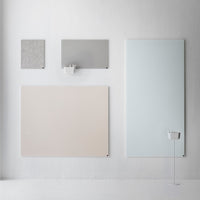 Light gray, soft beige, mint green, and textured gray wall art panels arranged on a minimalist background.