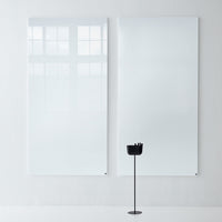 Glossy white wall panels with a smooth, reflective surface, paired with a sleek black stand on a minimalistic background.