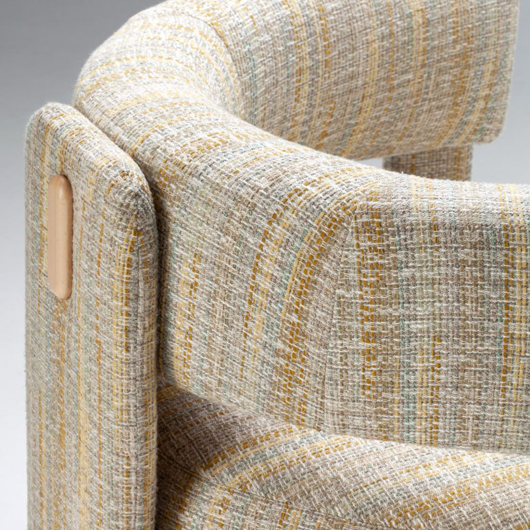 Textured fabric in soft beige with yellow and teal stripes, adding a modern touch to any decor.
