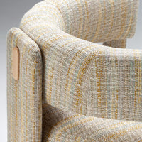 Textured fabric in soft beige with yellow and teal stripes, adding a modern touch to any decor.